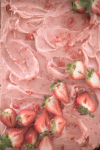 top of cake cut strawberries sprinkled freeze dried strawberries