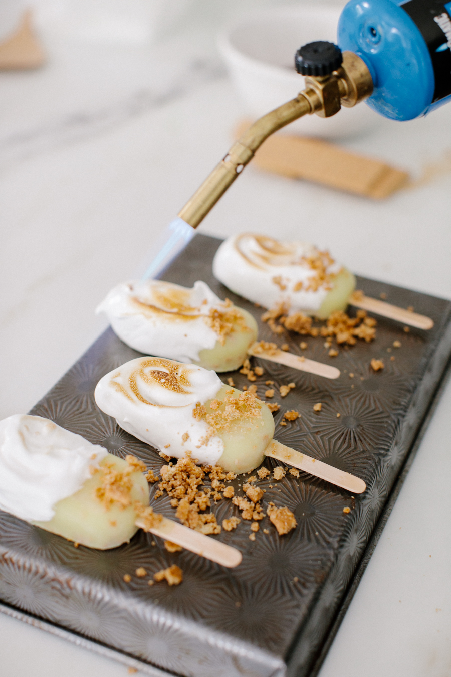 toasting the meringue on the popsicles 