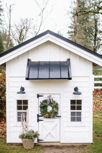 outdoor playhouse with wreath