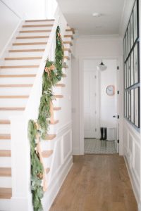 entryway with garland on banister