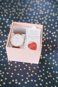 watch in box with strawberry pin
