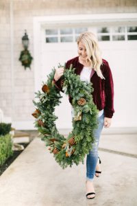 women walking with wreath