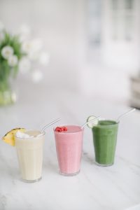smoothies on counter in a row