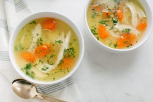 two bowls of chicken noodle soup overhead