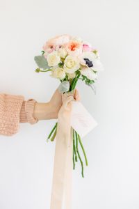 Hand holding bouquet