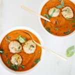Tomato Bisque in bowls with turkey meatballs and fresh basil