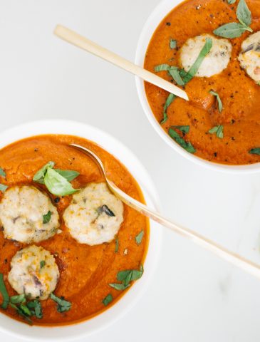 Tomato Bisque in bowls with turkey meatballs and fresh basil