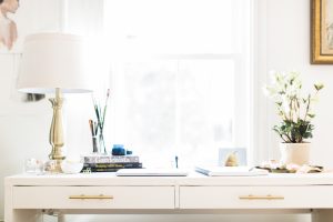 White desk with lamp and florals