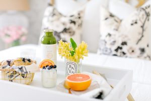 white tray with fresh breakfast on bed