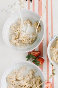 overnight oats with milk pouring into it