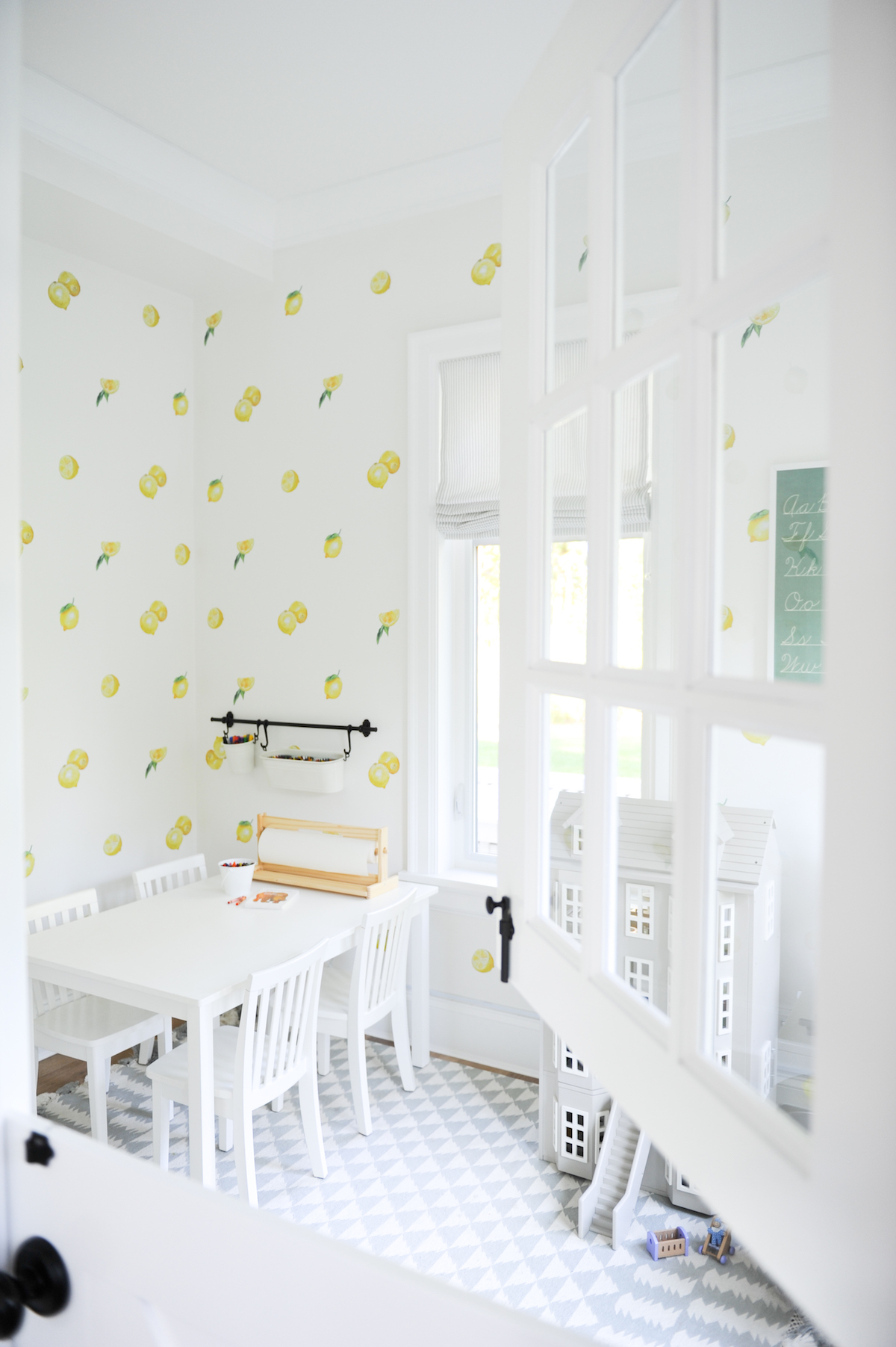 Airy kids playroom with lemon wallpaper