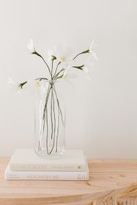 crepe paper daisy in glass vase