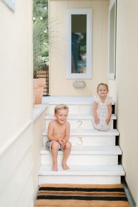 kids laughing on porch steps