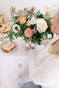 holding vase of florals