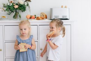 little girls eating toast