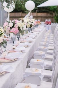 Boxed lunch on seat, white and pastel baby shower