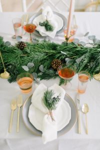 Christmas table setting with live greenery