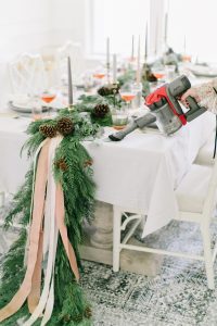 ribbon on live greenery on holiday tables cape