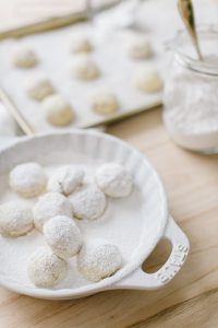 almond snowball cookies in icing sugar