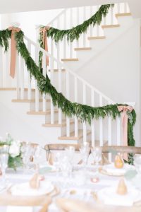 spring inspired staircase garland with peach-pink ribbons decor