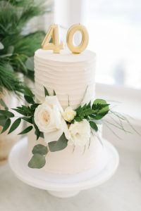 40th white two-tier cake with floral decor