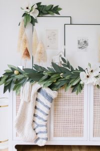 knit stockings on side board paper garland