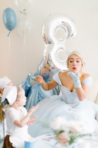 young girls blowing kisses with Cinderella