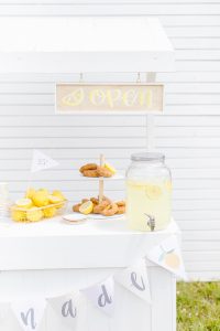 cute white lemonade stand with home made open sign