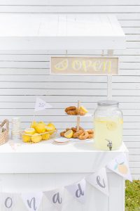 cute white lemonade stand with home made open sign