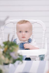 birthday baby boy in high chair
