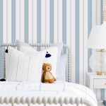 Little Boys Bedroom with Teddy Bear on the Bed and the #MHxUrbanWalls Wallpaper in Brighton Stripes in Blue