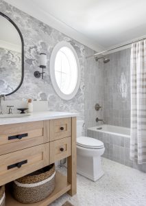 tiled small bathroom with cloud wallpaper